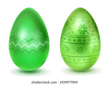 Two realistic Easter eggs with different surface texture, patterns and holiday symbols in green colors. With shadows on white background