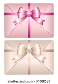 two realistic envelopes with glossy bows on white background