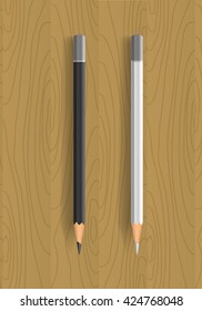 Two realistic pencils on wooden table. Black and white pencils. Vector illustration. 