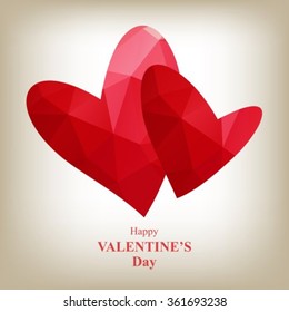 Two red bright polygonal hearts with lettering isolated on a gray background.