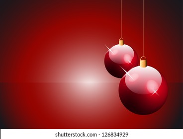two red Christmas balls hanging on string with copy space