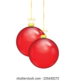 Two red Christmas balls on a gold ribbon isolated on white background