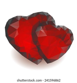 Two red crystal hearts isolated on a white background.