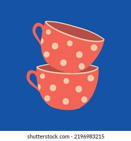 two red cups with polka dots