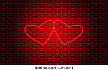 
Dos corazones de neón rojo brillante sobre un fondo de pared de ladrillo y un apagón.