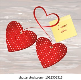 Two red hearts with bow and ribbon. Yellow sheet of paper for notes. Sticker. Valentine's Day. Vector illustration. Greeting card with empty space for the text or advertising. On wooden background.