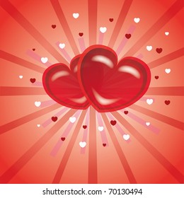 Two red hearts on a pink background