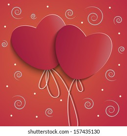Two red hearts on a string volume on the background with a pattern