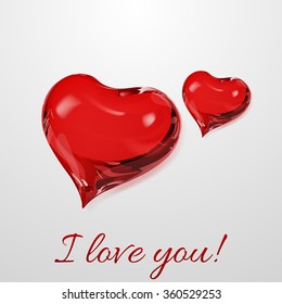 Two red hearts on white background with inscription I love you