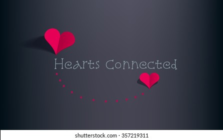 Two red paper hearts connected with red dots casting shadow on a dark background.