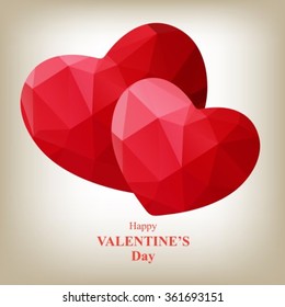 Two red polygonal hearts with lettering isolated on a gray background.