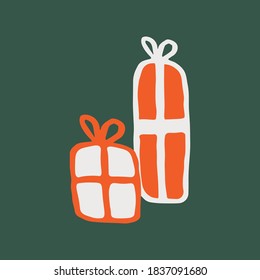two red and white christmas gift boxes on a green background