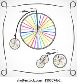 Two retro bicycles with rainbow colored wheels on white background