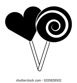 two round lollipop and heart shape candy