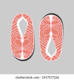 two salmon fillets on grey background