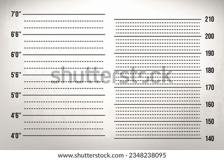 Two scales on the wall: in inches and centimeters. Ruler for height identification. Template for mugshot photo.