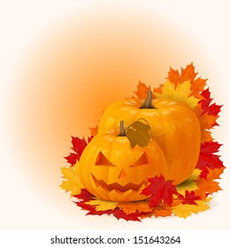 two scary smile halloween pumpkins with fall maple leaves