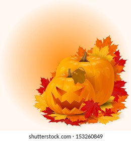 two scary smile halloween pumpkins with fall maple leaves