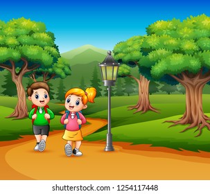 Two school children are walking on the road a forest