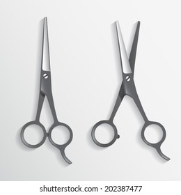 Two scissors, opening and closed haircutting shears for Hairdresser's salon