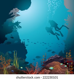 Two scuba divers and coral reef with underwater creatures. 