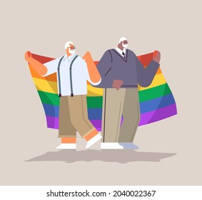 two senior men holding lgbt rainbow flag gay lesbian love parade pride festival transgender love concept