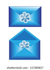two shiny blue Christmas envelope with snowflakes. One envelope is opened, the other closed.