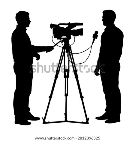 Two silhouetted individuals involved in a media interview setup with camera and microphone, capturing a professional broadcast scene.