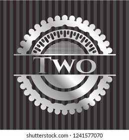 Two silvery badge