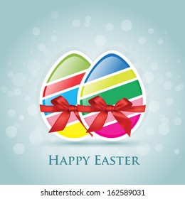 Two sliced colored eggs with red bow - Happy Easter greeting card 