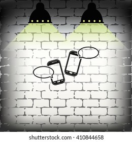 Two smartphones with blank speech bubbles on the screen. 