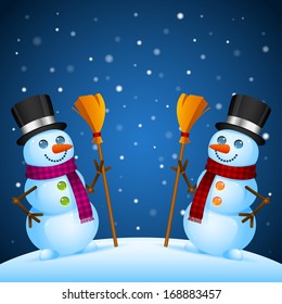 Two snowmen stand with broom