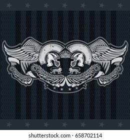 Two Spartan helmets between wings with palm or olive wreath. Heraldic vintage label on blackboard