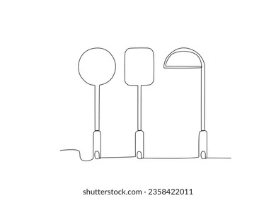 Two spatulas and a vegetable spoon. Cooking and kitchen tools one-line drawing