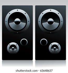 Two speakers reflecting on the floor.
