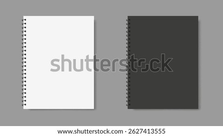 two spiral binder notebooks with black and white cover, place for text, gray background