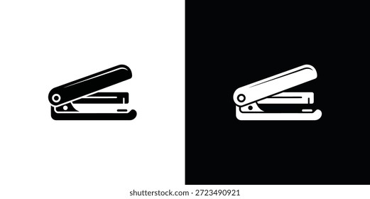 Dos grapadoras en blanco y negro sobre fondo negro