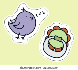 Two stickers with a bird and a pacifier