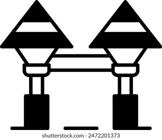 Two street lights are connected by a rope. The lights are black and white