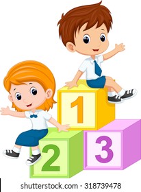 Two students sitting on the numbers blocks 