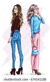 Two stylish beautiful women. Fashion girls with accessories. Hand drawn girls in fashion clothes. Fashion look. Sketch. Vector illustration.