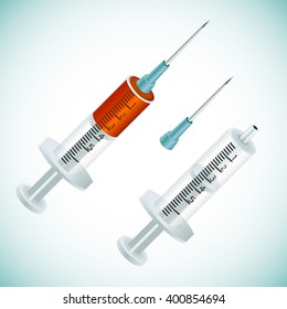 Two syringes, one empty, the other filled with blood or injectable solution. The empty syringe with needle is disconnected.