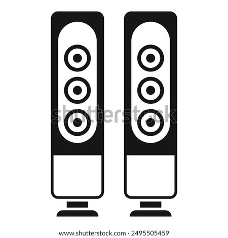 Two tall black audio speakers standing on the floor are perfect for listening to loud music at home