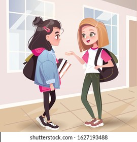 Two teenage girls talking in the school hallway.