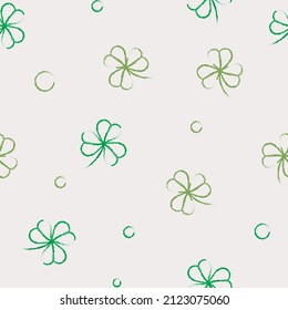 Two tone green clover leaf or Japanese lucky leaves on a very light cream background. And you can use it on Saint Patrick’s Day. It is a seamless vector pattern work.