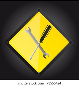 two tools over yellow sign over black background. vector illustration