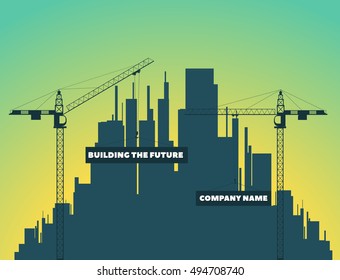 two tower cranes on a background of houses, city and sunset