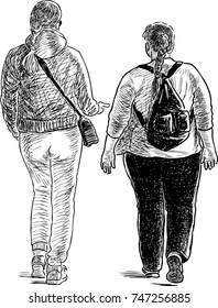 Two townswomen talk on a walk
