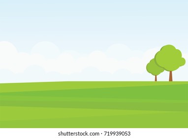 Two trees on a green meadow against a background of clouds. Freedom and clean air.