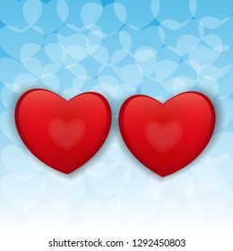 two volume red hearts on a blue background
